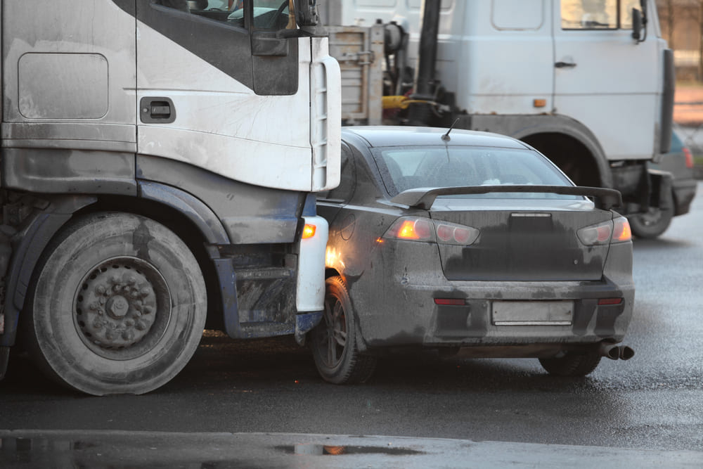 car hit by semi truck