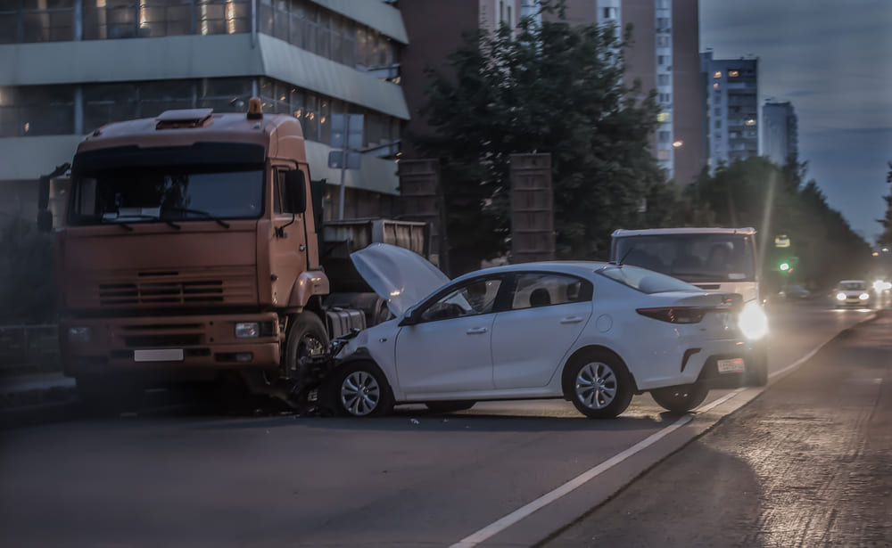truck accident with car at night