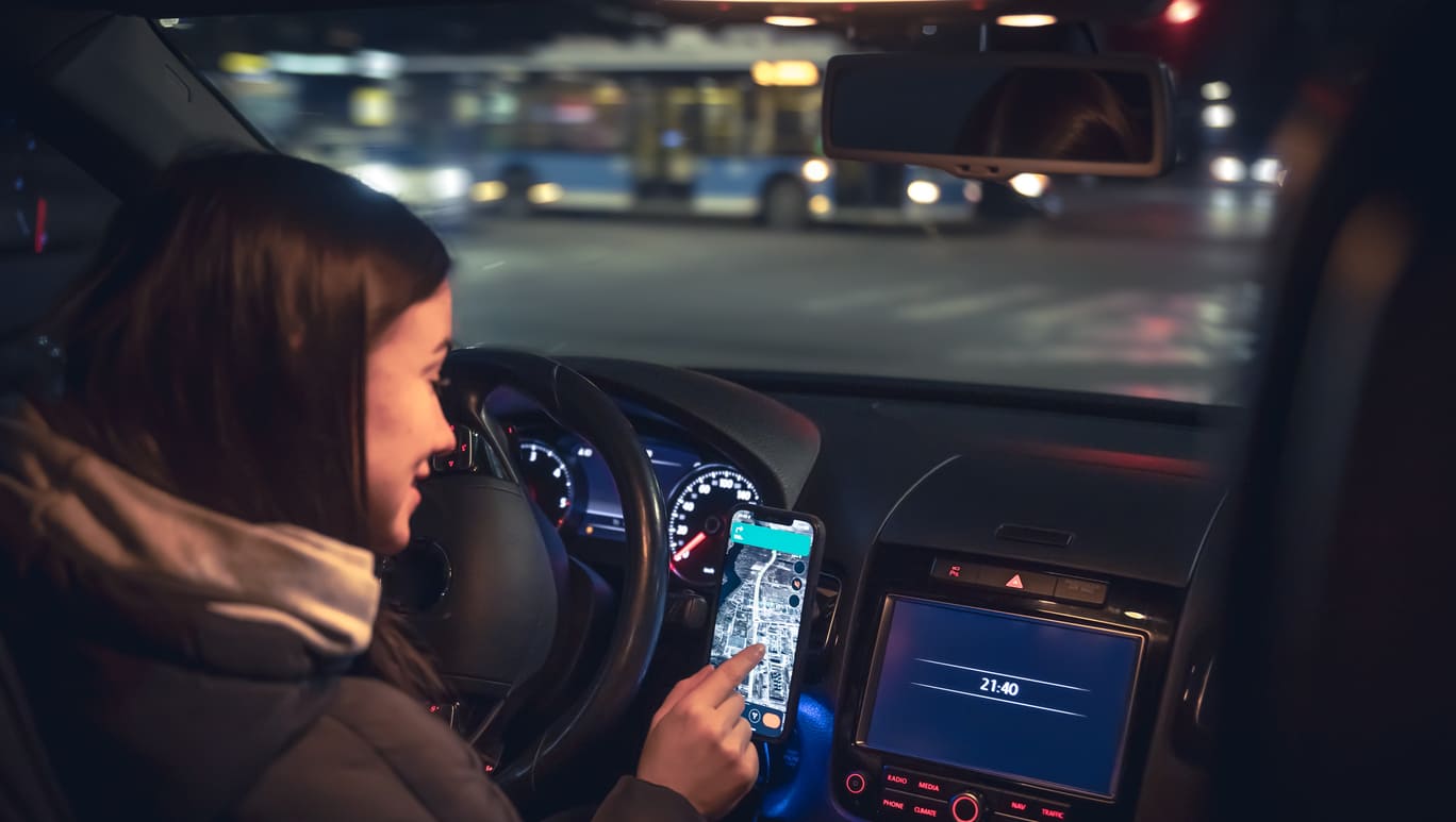 distracted driver using phone navigation while driving