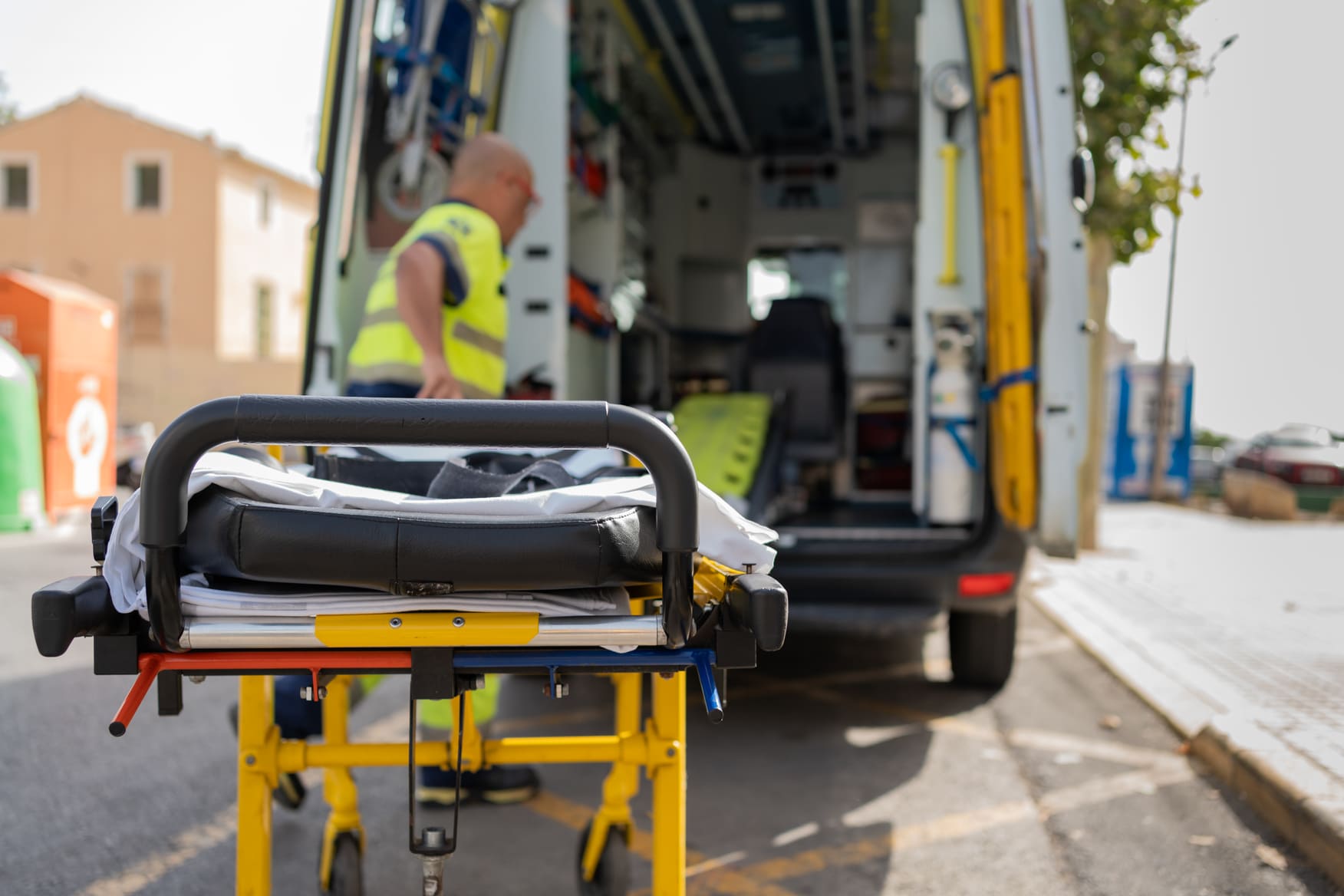 paramedic with stretcher at the scene of a rollover car accident