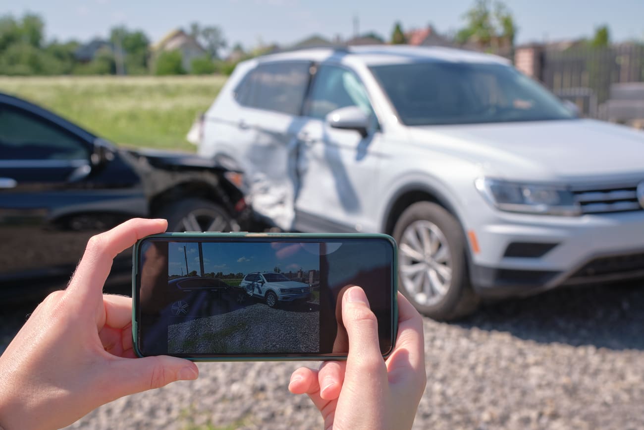 driver taking photos after t-bone car accident